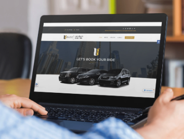 Transportation and black car service company website design displayed on a laptop.
